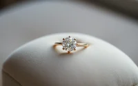 Showcase a stunning 3 Carat Engagement Rings glistening elegantly in soft light on a plush surface.